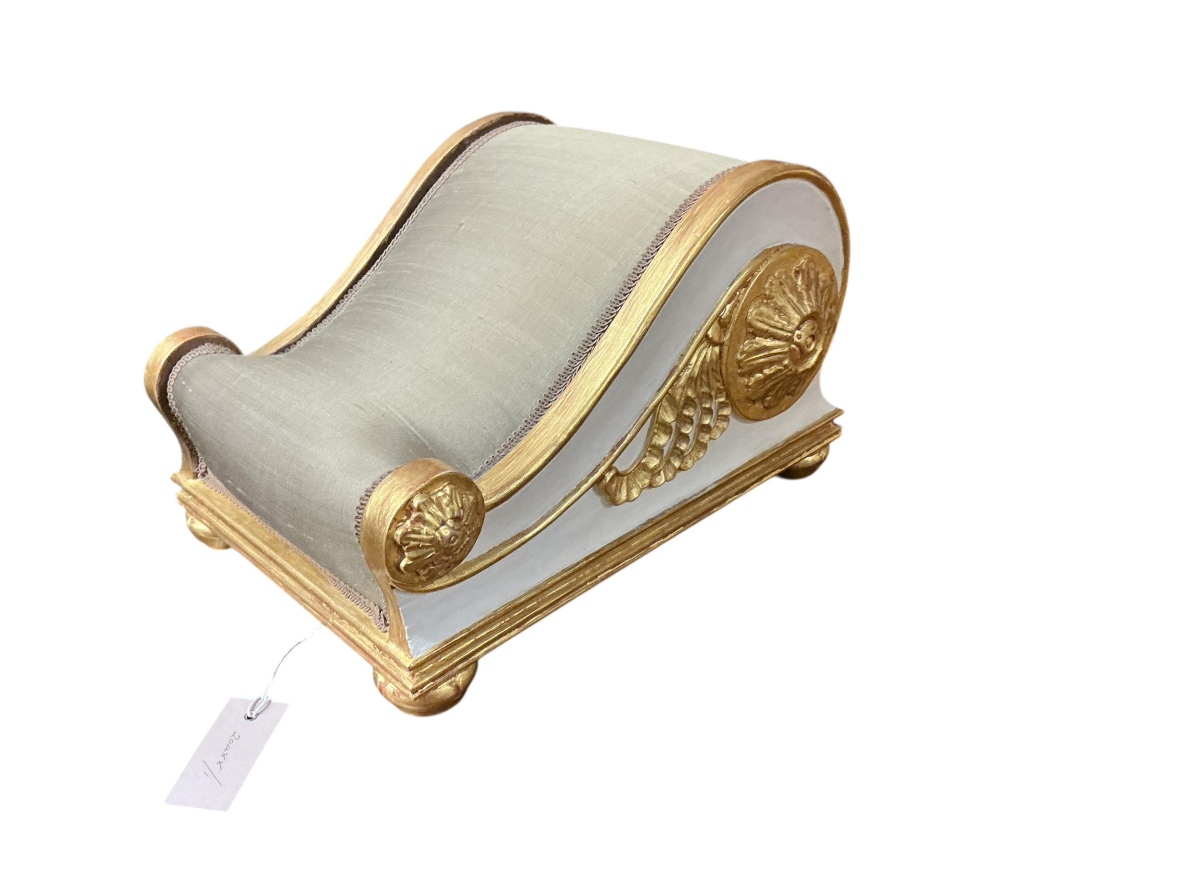 A pair of Regency style painted upholstered footstools, width 28cm, depth 36cm, height 22cm